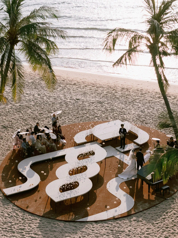 A Cinematic Beach Wedding in Vietnam with a Sunset Ceremony Framed by Dandelions