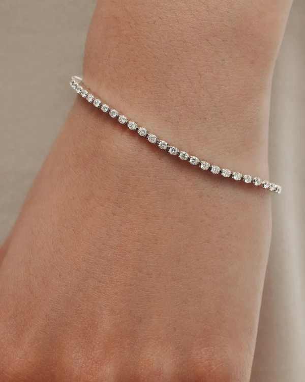 <a href="https://www.sarahandsebastian.com/en-us/products/petite-tennis-bracelet-white-gold">SARAH & SEBASTIAN Tennis Bracelet</a>, $10,125
