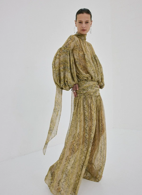 <a href="https://www.delavali.com/products/solana-maxi-dress-in-serpiente-yellow-poly-chiffon">DE LA VALI Chiffon Maxi Dress, $930</a>