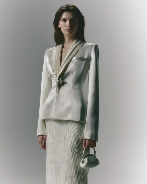 <a href="https://www.daniellefrankelstudio.com/products/esther?_pos=2&amp;_sid=06b8d9f58&amp;_ss=r">DANIELLE FRANKEL Jacket</a>, Price Upon Request;&nbsp;<a href="https://www.daniellefrankelstudio.com/products/gia">DANIELLE FRANKEL Skirt</a>, Price Upon Request