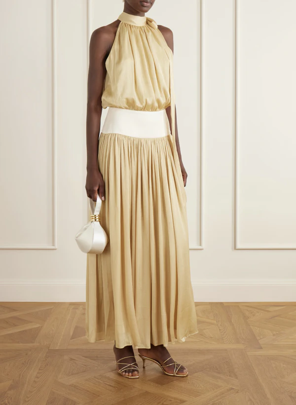 <a href="https://www.net-a-porter.com/en-gb/shop/product/abadia/clothing/midi-dresses/knotted-halterneck-satin-trimmed-crepon-midi-dress/46376663163125405">ABADIA Knotted Halterneck Satin-Trimmed Crepon Midi Dress from Net-a-Porter, $1,150</a>