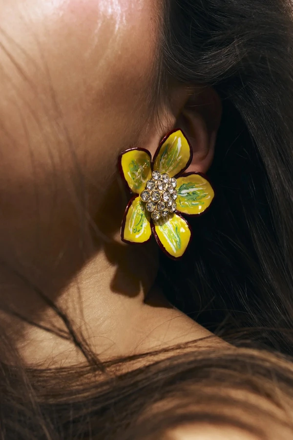 <a href="https://www.aminamuaddi.com/products/vittoria-earring-green-yellow-enamel-and-white-crystals">AMINA MUADDI Earrings</a>, $623