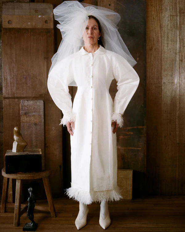 <a href="https://cawleystudio.com/collections/bridal-2/products/heidi-dress-porcelain-silk-taffeta?variant=52954038468874">CAWLEY Dress</a>, $2735