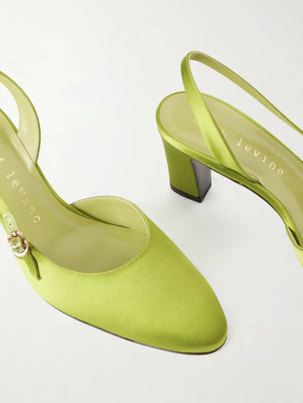 <a href="https://www.net-a-porter.com/en-us/shop/product/herbert-levine/shoes/mid-heel/ask-around-65-satin-slingback-pumps/46376663163082474">HERBERT LEVINE Satin Slingback Pumps from Net-a-Porter, $1,100</a>