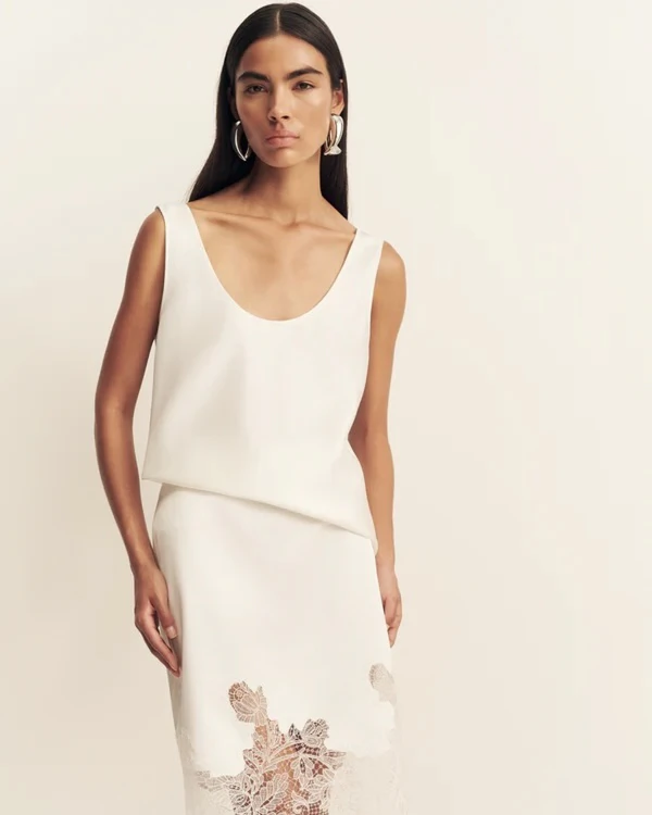 <a href="https://shonajoy.com/collections/morning-of/products/lucia-lace-knee-length-skirt-ivory">SHONA JOY Skirt</a>, $240