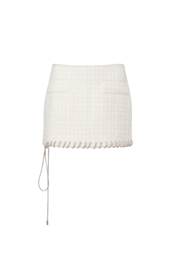 <a href="https://www.mytheresa.com/us/en/women/area-embellished-tweed-miniskirt-white-p01136387">AREA Skirt</a> from Mytheresa, $850