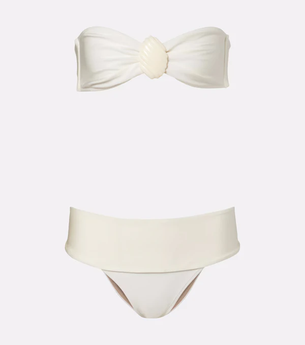 <a href="https://www.mytheresa.com/us/en/women/adriana-degreas-embellished-bandeau-bikini-white-p01169190">ANDREA DEGREAS Embellished Bandeau Bikini</a> from Mytheresa, $340
