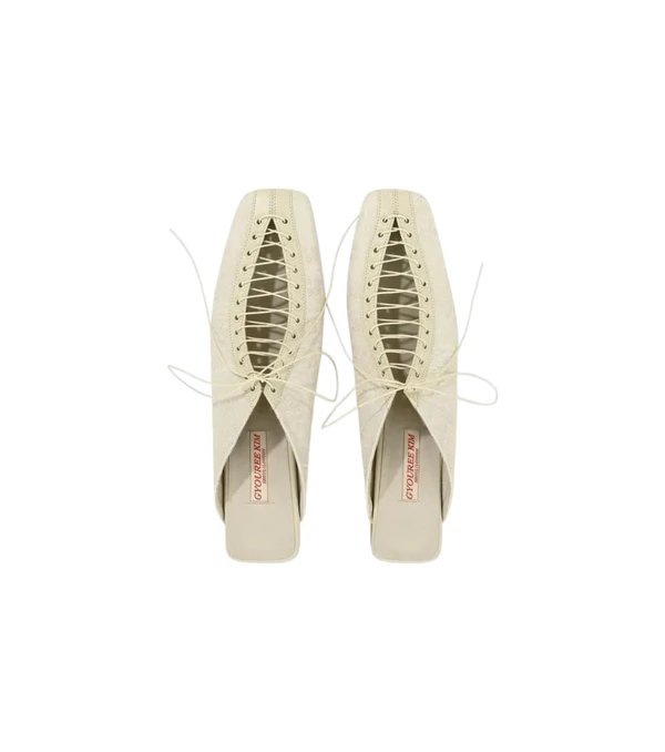 <a href="https://apoc-store.com/products/lace-mule-cream">GYOUREE KIM Mules</a> from Apoc, $543