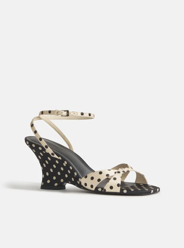 <a href="https://www.thereformation.com/products/margo-wedge-sandal/1317737LKA.html?dwvar_1317737LKA_color=LKA&amp;_gl=1*wbgfzv*_up*MQ..&amp;gclid=CjwKCAjw_KjVBhAHEiwAnC0N9DF-3jIUfsENWQqtITtit8wdQU76NJSIHPVF-FDdbDH299cdCElpehoC84MQAvD_BwE&amp;gbraid=0AAAAADmLagUekqBwbJq6pWsecmzoPJeGK">REFORMATION Satin Wedge Sandals, $298</a>