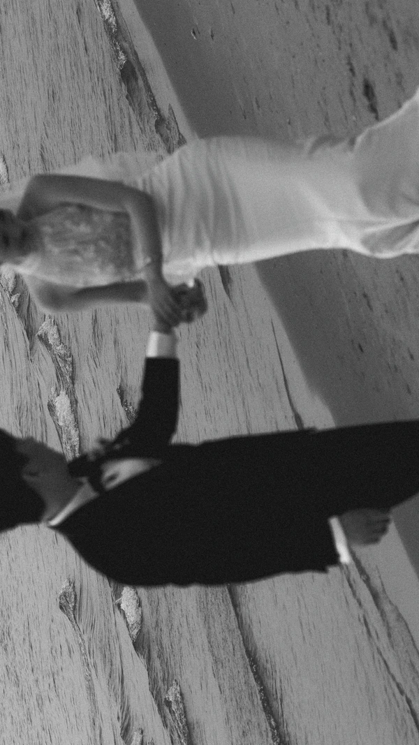 A Cinematic Beach Wedding in Vietnam with a Sunset Ceremony Framed by Dandelions
