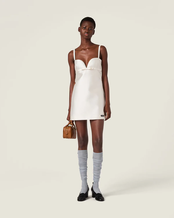 <a href="https://www.miumiu.com/us/en/p/silk-and-wool-mini-dress/MF6167_BH7_F0009_S_OOO" target="_blank">MIU MIU Silk and Wool Mini-Dress, $3,700</a>