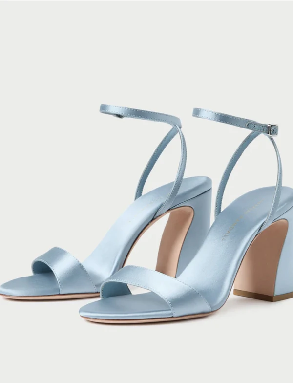 <a href="https://loefflerrandall.com/products/malia-blue-satin-heeled-sandal?variant=45734688522292&amp;country=US&amp;currency=USD&amp;utm_medium=product_sync&amp;utm_source=google&amp;utm_content=sag_organic&amp;utm_campaign=sag_organic&amp;tw_source=google&amp;tw_adid=&amp;tw_campaign=24182900522&amp;tw_kwdid=&amp;gad_source=1&amp;gad_campaignid=24182907593&amp;gbraid=0AAAAAD2dN27ml89k5xytaGaopcoMhfccv&amp;gclid=CjwKCAjw_KjVBhAHEiwAnC0N9AH6VO3H5p_Ehr5mMlg6RslYFqAgkmghutVF9VheSFiHAXzGmxOc4BoCrqcQAvD_BwE">LOEFFLER RANDALL Blue Satin Heeled Sandals, $395 </a>