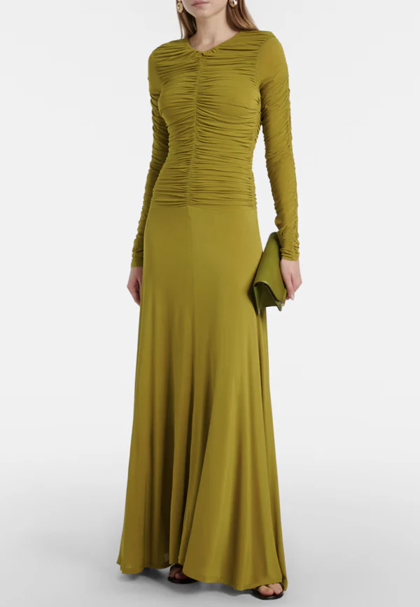 <a href="https://www.mytheresa.com/us/en/women/tove-eira-gathered-maxi-dress-green-p01123834?dplink=true&utm_source=sea_pla&utm_medium=google&utm_campaign=google_sea&chn=sea_shopping&src=google&cmp=22079130196&tarea=us&tar=&ag=&ptyp=&feed_num=P01123834-3&gclid=CjwKCAjwlY3WBhANEiwApsNrLXnWQvVb4taWejENTA6XhenxDYicewcgEhqinVtYteSUlg2vE6ahOhoCg7wQAvD_BwE&gbraid=0AAAAAD3Pw-nyYRHNqpq3b8iu-j-xDLrMC&gad_source=1&gad_campaignid=22079140273&gbraid=0AAAAAD3Pw-nyYRHNqpq3b8iu-j-xDLrMC&slink_id=ecc83ea2-a977-4e29-ad67-d8889941de53&slink=1">TOVE Gathered Maxi Dress from MyTheresa, $714</a>