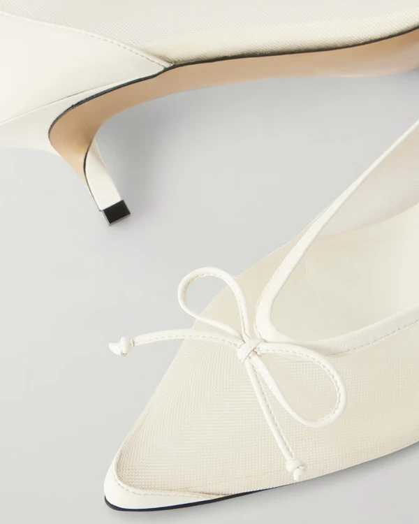 <a href="https://www.net-a-porter.com/en-us/shop/product/jacquemus/shoes/mid-heel/tourni-bow-detailed-leather-trimmed-mesh-pumps/46376663162974860">JACQUEMUS Tourni Mesh Pumps</a> from Net-A-Porter, $920