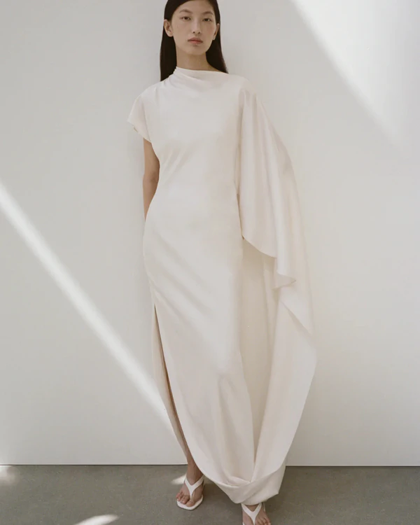 <a href="https://simkhai.com/products/ora-satin-gown" target="_blank">SIMKHAI Ora Satin Gown, $895</a>